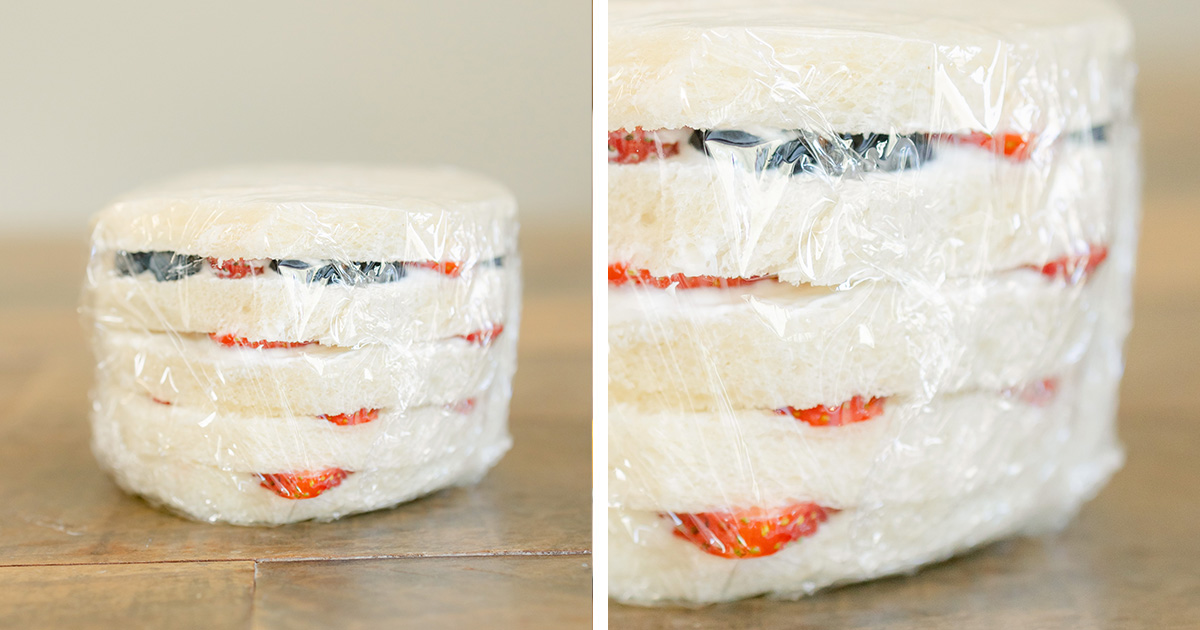cake with slices strawberries and blueberries 