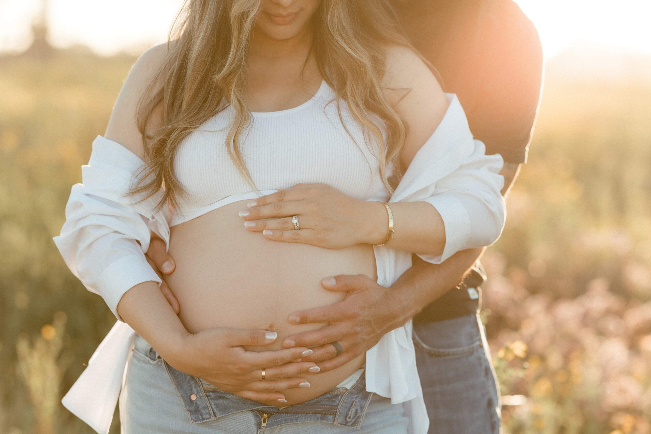 maternity photo in the field at sunset