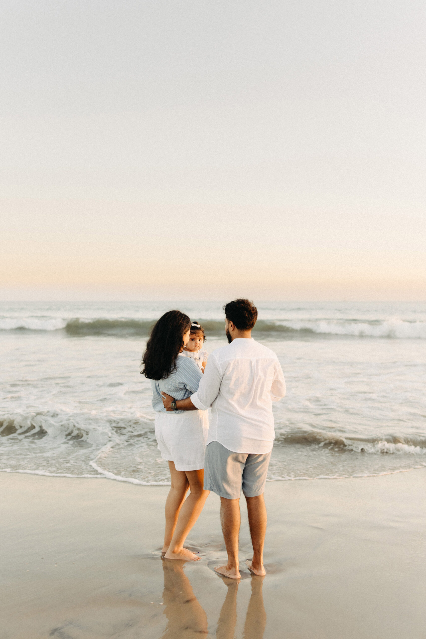 Young family in the beach